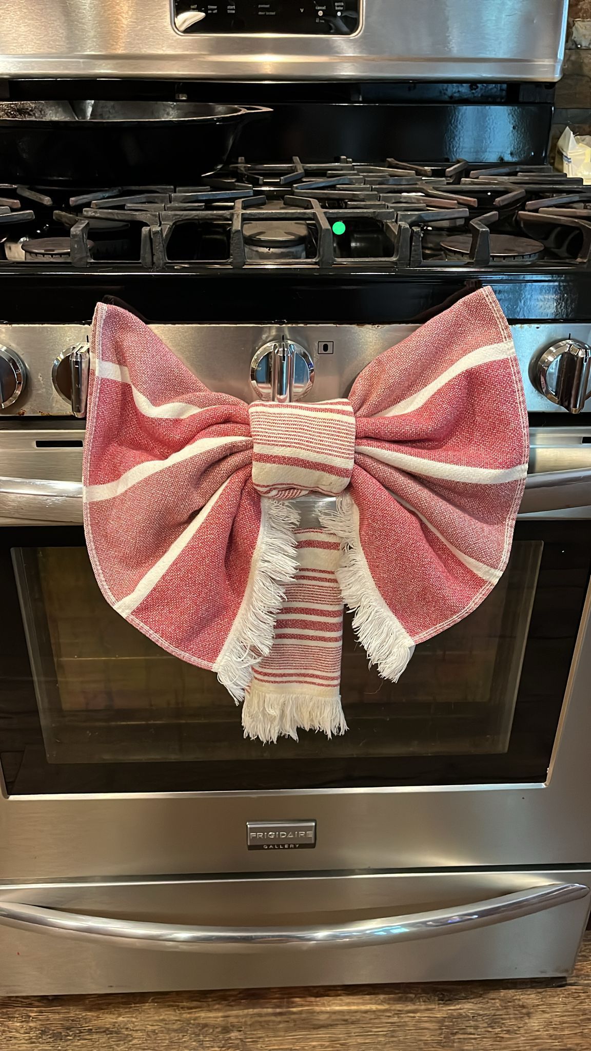 Spotless kitchen stove with decorative towel bow